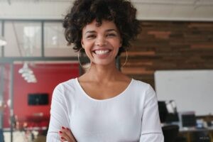 African American Woman Smiling In an Office Setting