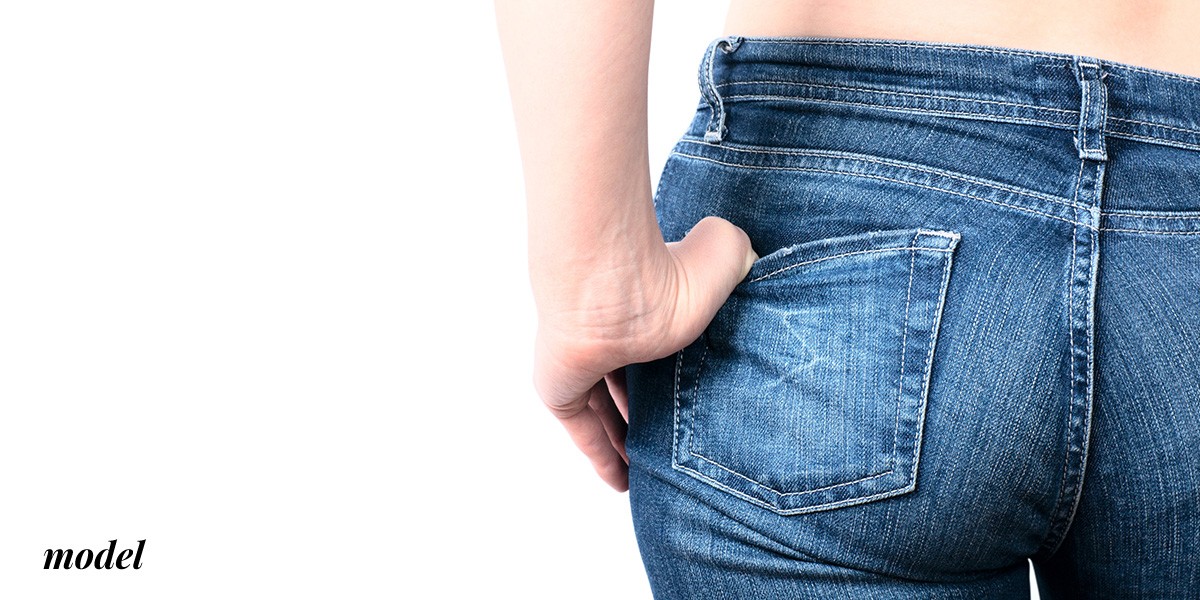 Close Up of Buttocks in Jeans With One Finger In Pocket